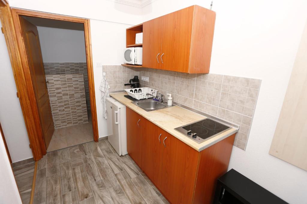 Kuchyň nebo kuchyňský kout v ubytování Total Relax Apartmanház
