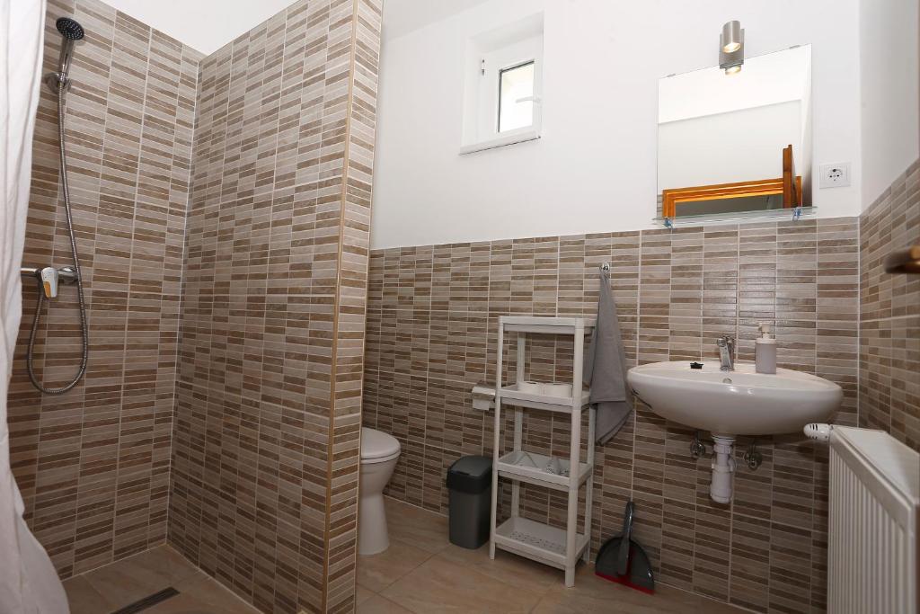 Koupelna v ubytování Total Relax Apartmanház