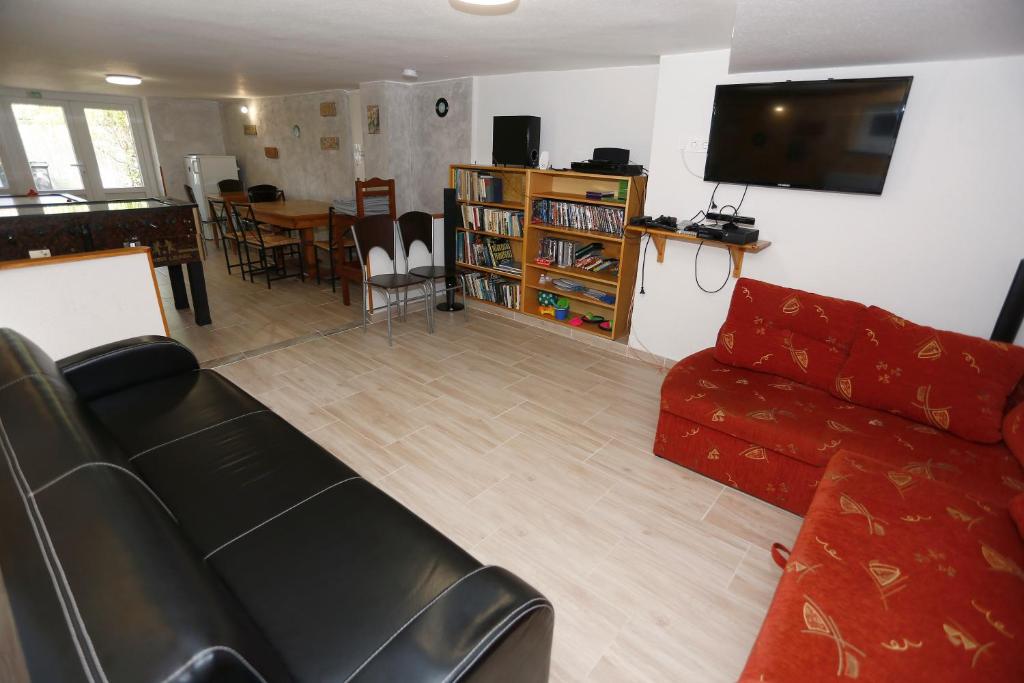 TV a/nebo společenská místnost v ubytování Total Relax Apartmanház