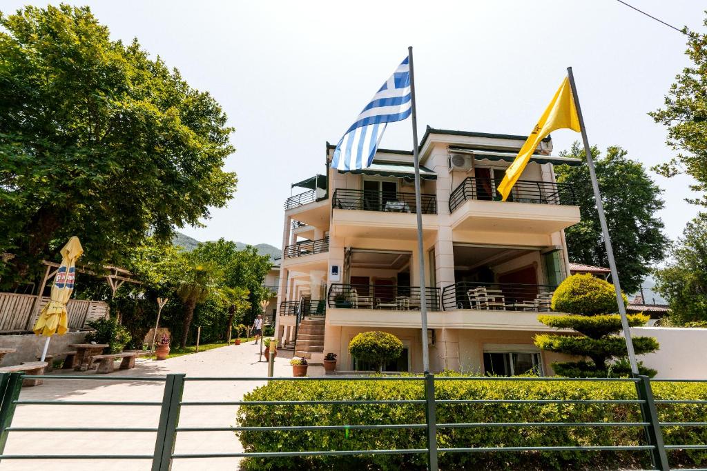 a building with flags in front of it at Stefanidis studios in Stavros