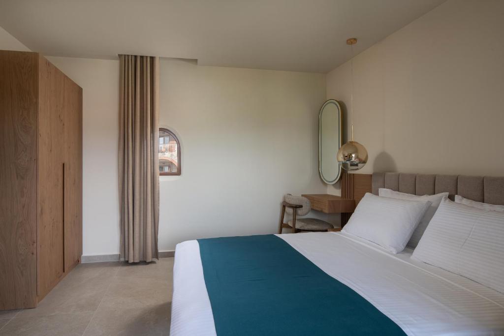 Postel nebo postele na pokoji v ubytování Hotel Pontos