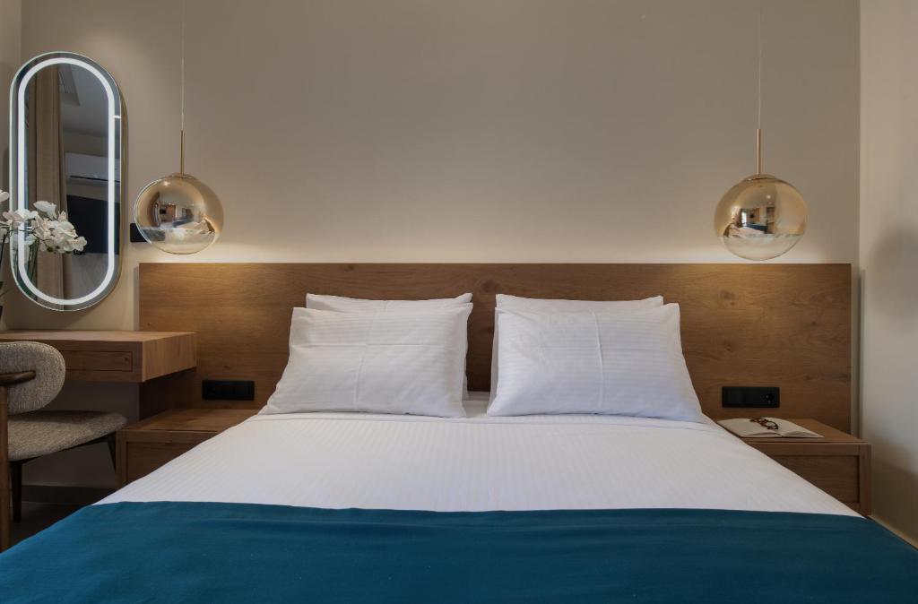 Postel nebo postele na pokoji v ubytování Hotel Pontos