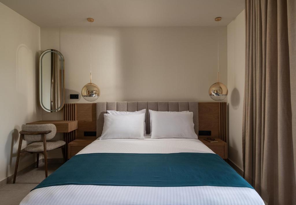 Postel nebo postele na pokoji v ubytování Hotel Pontos