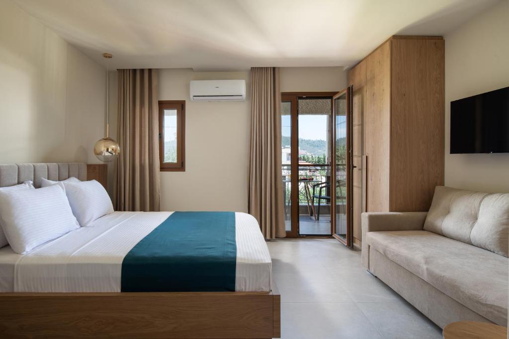 Postel nebo postele na pokoji v ubytování Hotel Pontos