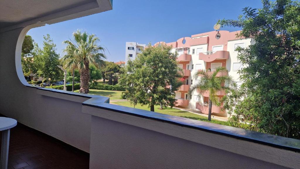 a balcony with a view of a building at Parque das Amendoeiras in Vilamoura