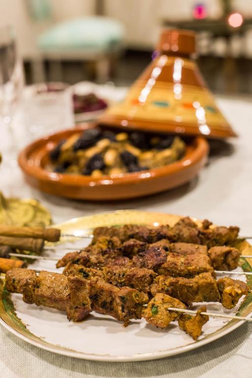 a plate of food sitting on a table at Riad Amor - Suite & Spa in Fès