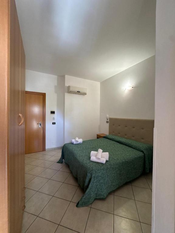 Postel nebo postele na pokoji v ubytování Hotel Anthos