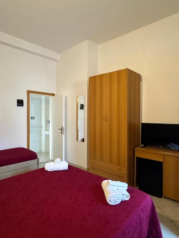 Postel nebo postele na pokoji v ubytování Hotel Anthos