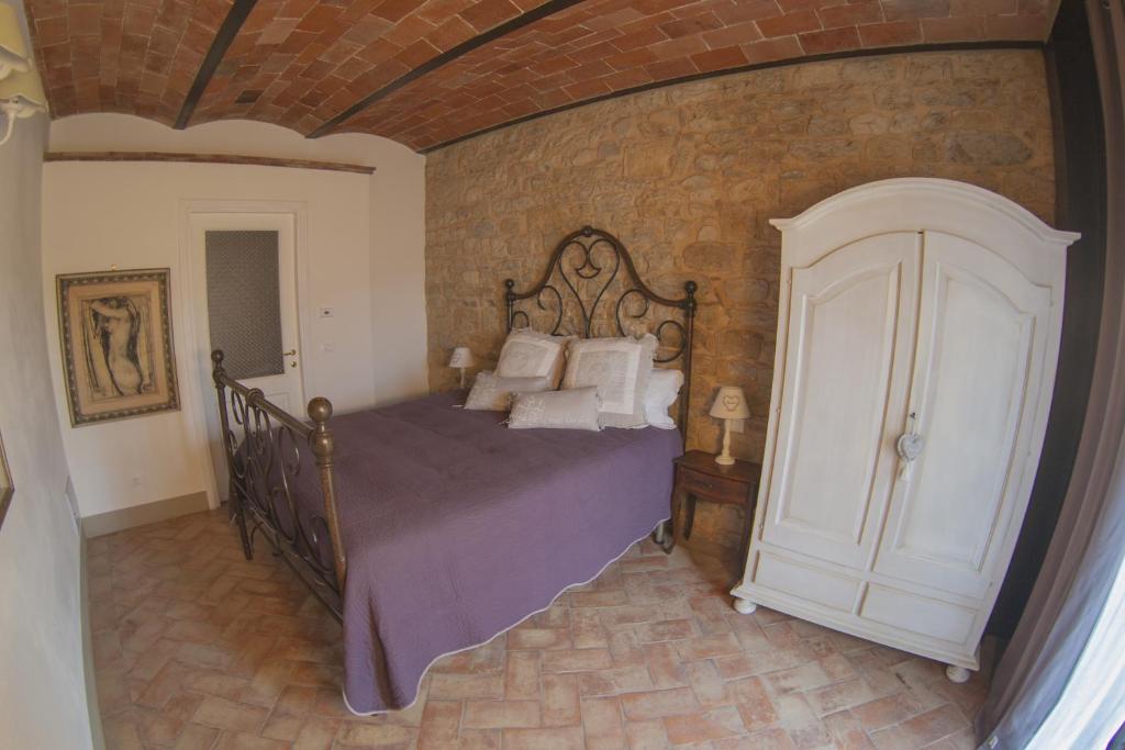 Postel nebo postele na pokoji v ubytování Borgo di Vezzano
