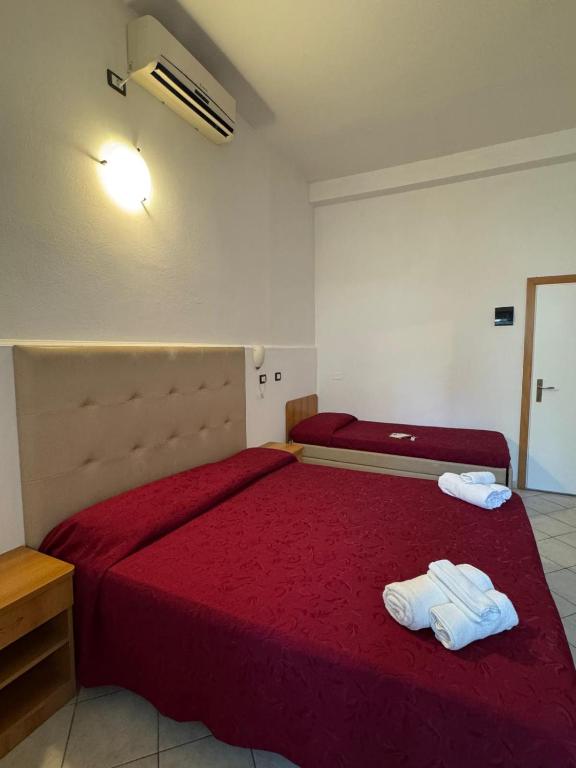Postel nebo postele na pokoji v ubytování Hotel Anthos