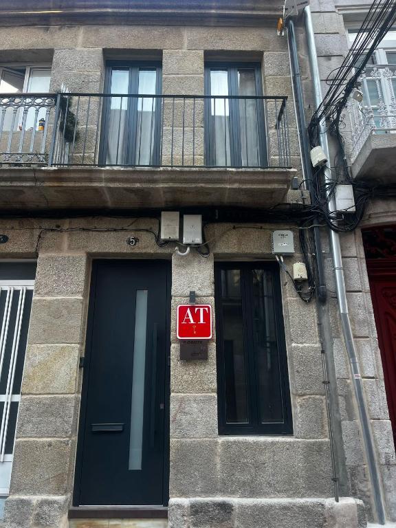 an ak sign on the side of a building at La casita by DADO in Vigo