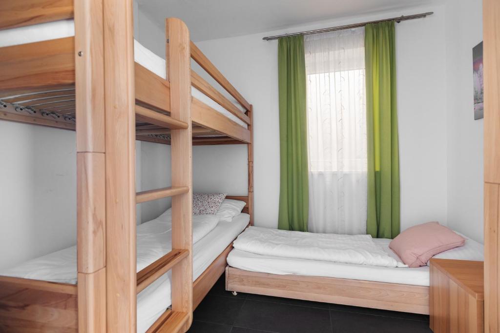 a room with two bunk beds and a window at Lux 11 in Sonnenalpe Nassfeld