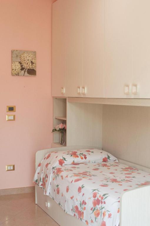 Posteľ alebo postele v izbe v ubytovaní Casa Mediterranea: appartamento vista mare a soli 200m dalla spiaggia