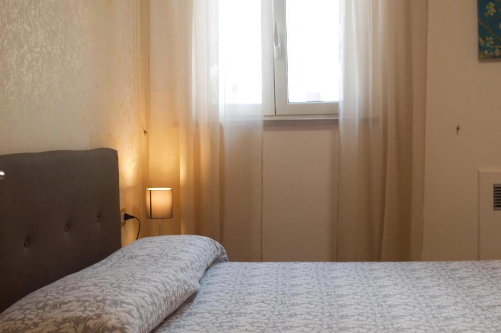 Posteľ alebo postele v izbe v ubytovaní Casa Mediterranea: appartamento vista mare a soli 200m dalla spiaggia
