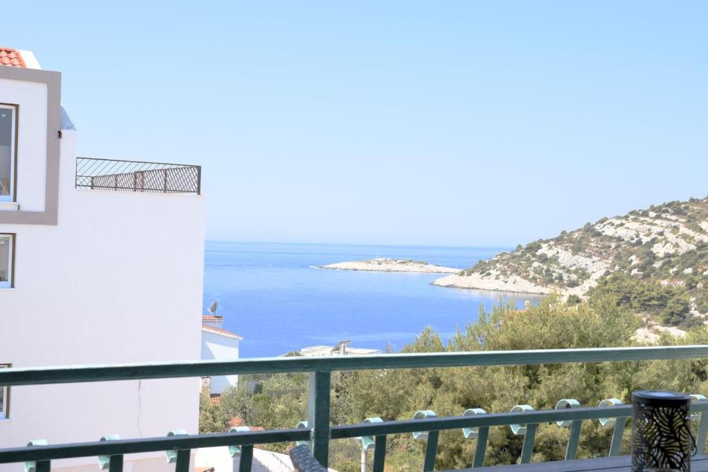 a view of the ocean from the balcony of a house at Villa Luger 2 Dachgeschoss in Rogoznica