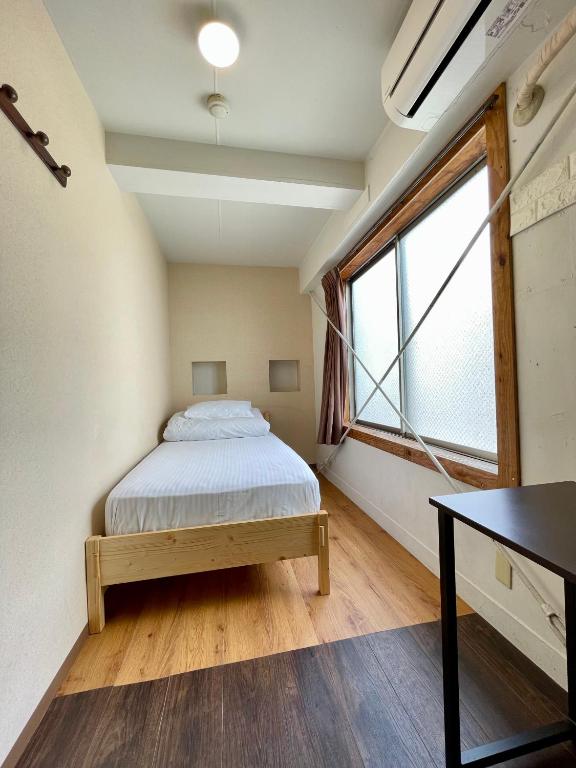 Postel nebo postele na pokoji v ubytování Nomad Hostel East