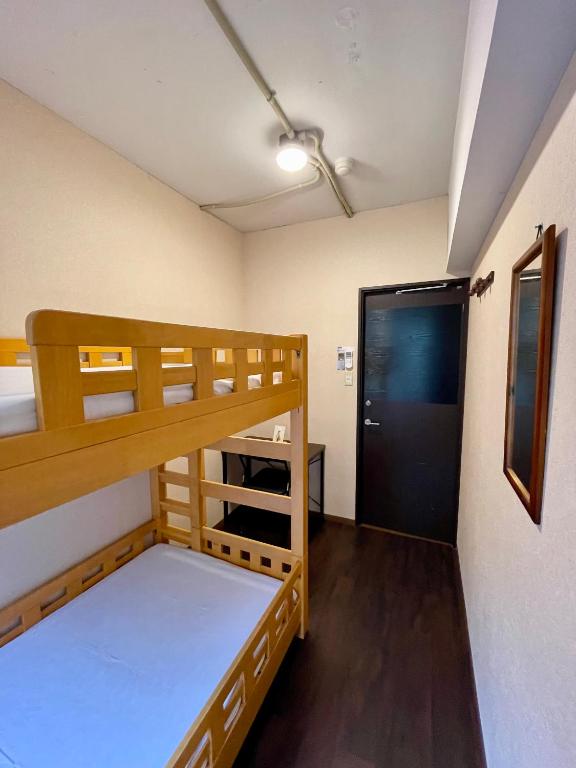Postel nebo postele na pokoji v ubytování Nomad Hostel East