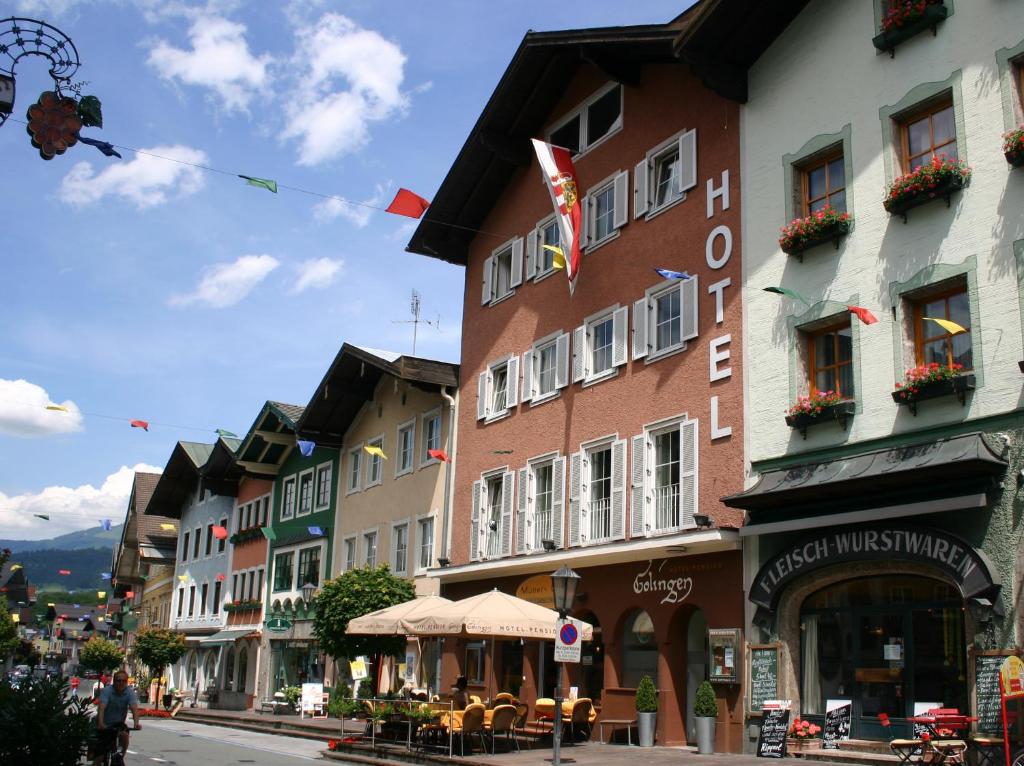 a group of buildings on a street in a town at Hotel.Pension.Golingen in Golling an der Salzach
