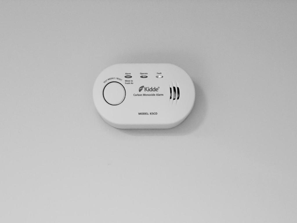 a light switch on a white wall at Ioannina Center Apartment in Ioannina