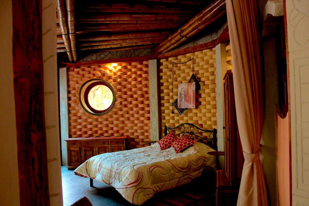 Postel nebo postele na pokoji v ubytování Finca Chamanapamba Guest House