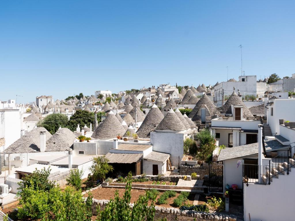 an aerial view of a village with roofs at Dimora Perta in Alberobello
