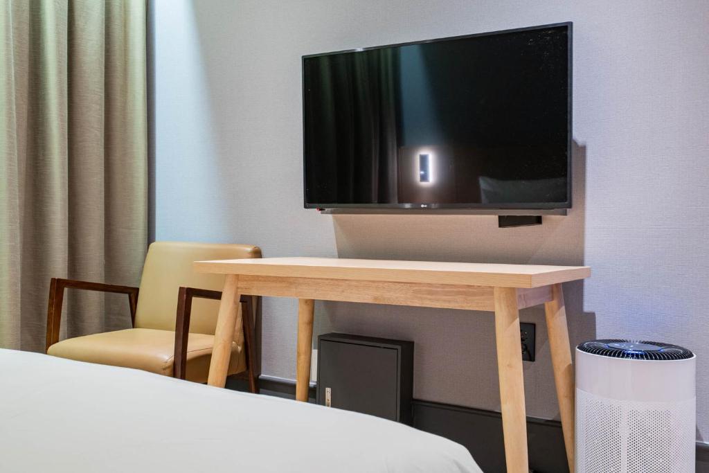 TV a/nebo společenská místnost v ubytování Healasis
