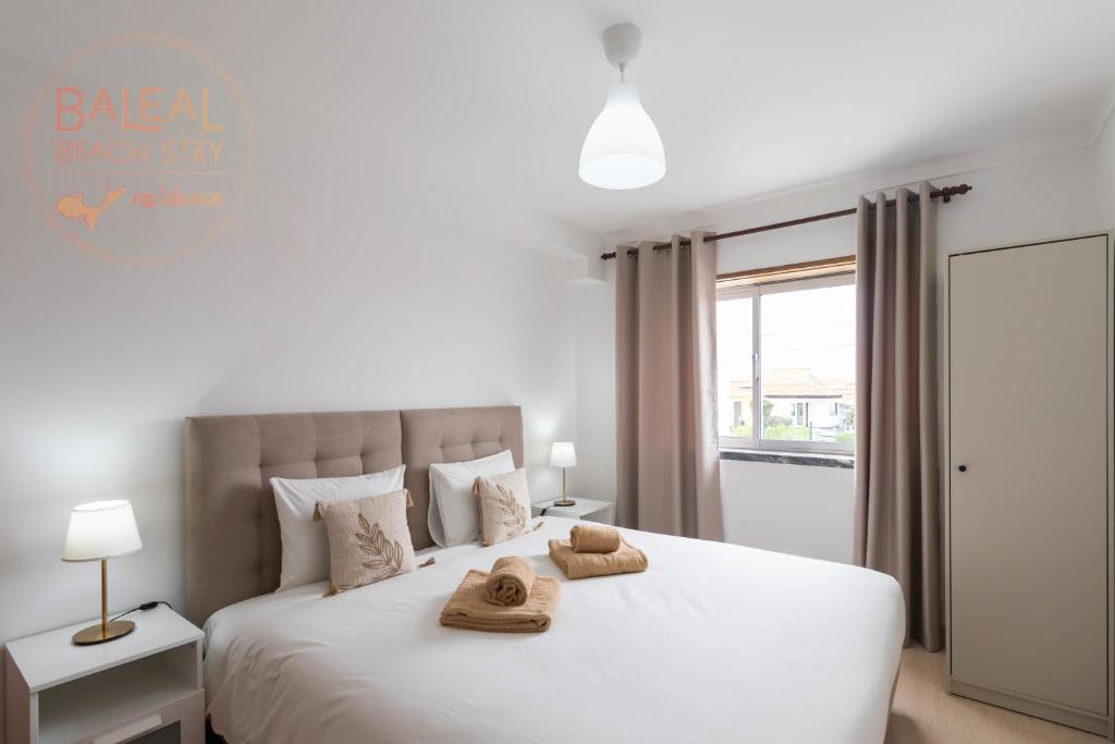 Ένα ή περισσότερα κρεβάτια σε δωμάτιο στο Baleal Beach Stay