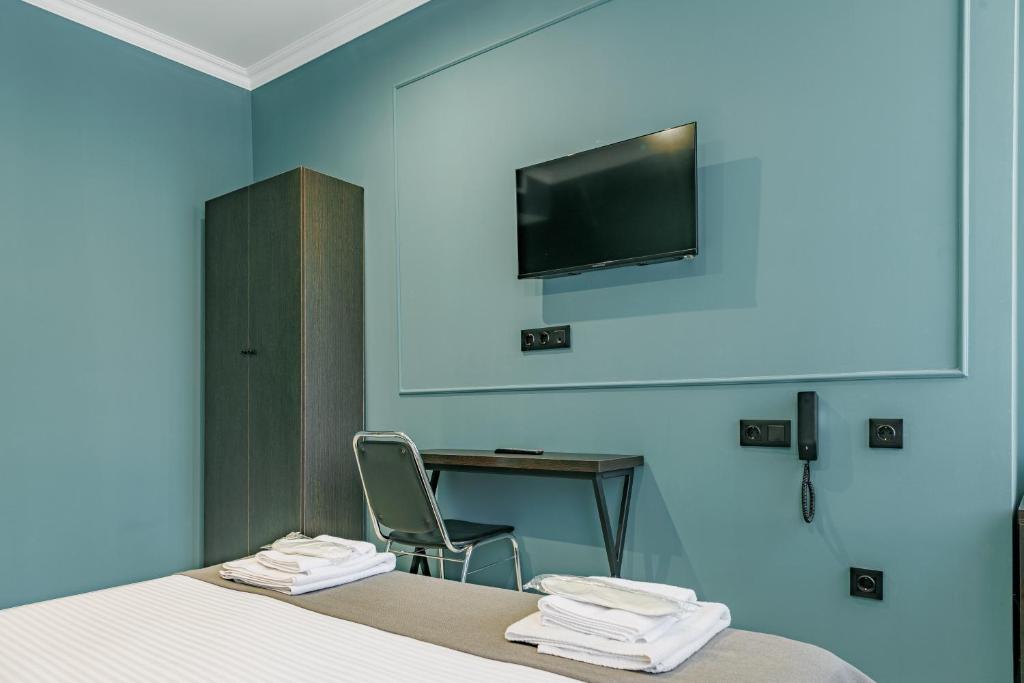 TV a/nebo společenská místnost v ubytování Route Hotel