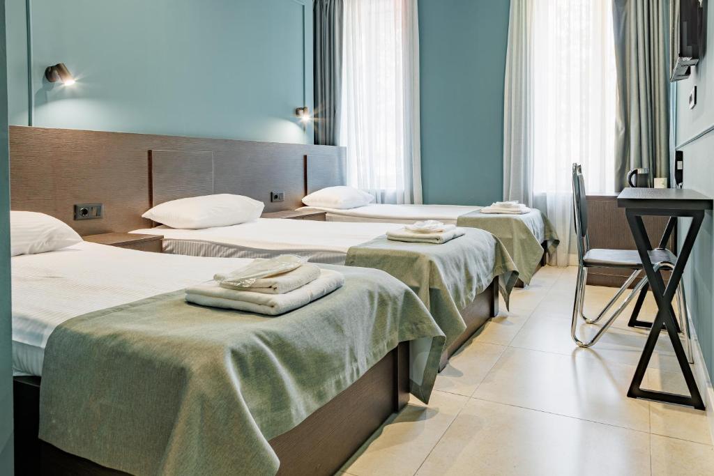 Postel nebo postele na pokoji v ubytování Route Hotel
