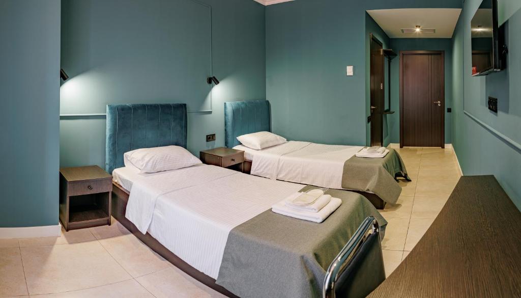 Postel nebo postele na pokoji v ubytování Route Hotel