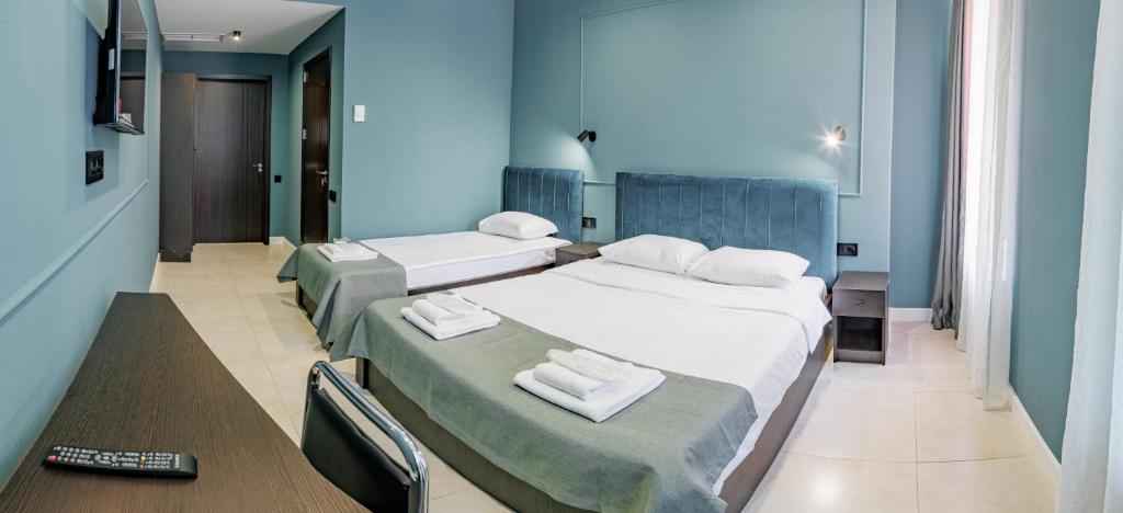 Postel nebo postele na pokoji v ubytování Route Hotel