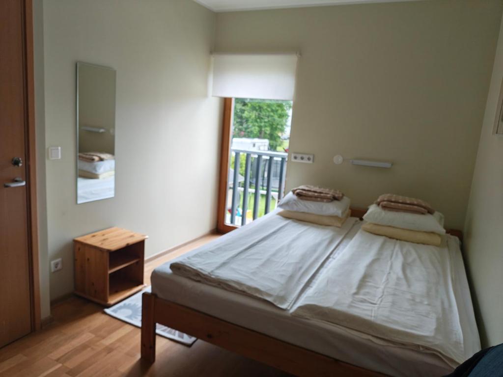 Postel nebo postele na pokoji v ubytování Aisa Accommodation