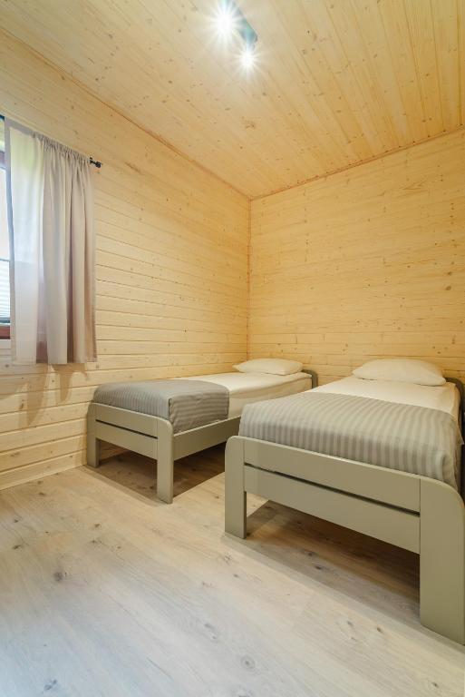 Postel nebo postele na pokoji v ubytování O.W. Laguna