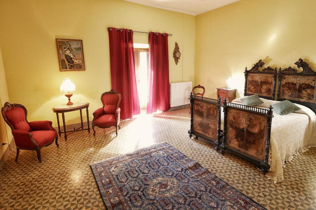 Ένα ή περισσότερα κρεβάτια σε δωμάτιο στο Palazzo Massa