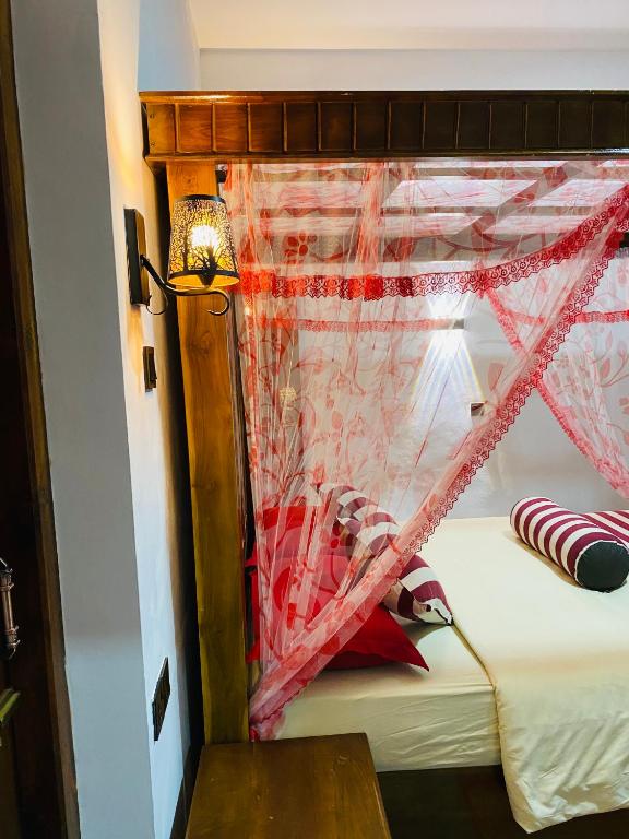 Postel nebo postele na pokoji v ubytování Madushanka Resort