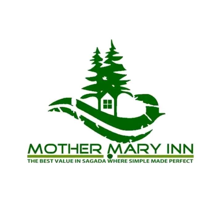 a logo for a winter marry inn with a tree at Mother Mary Inn in Sagada