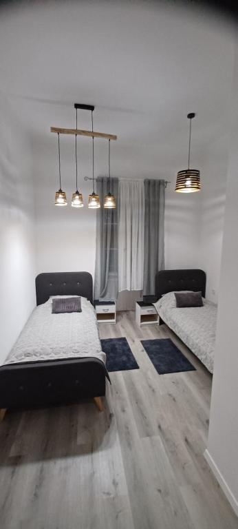 Ένα ή περισσότερα κρεβάτια σε δωμάτιο στο Apartmandamir