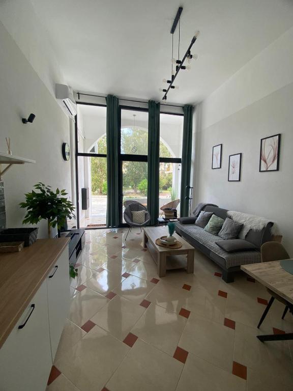 a living room with a couch and a table at Apartament Hana in Golem