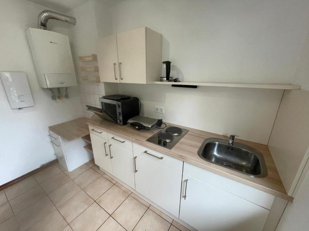 Køkken eller tekøkken på MAD Ferienwohnungen 3