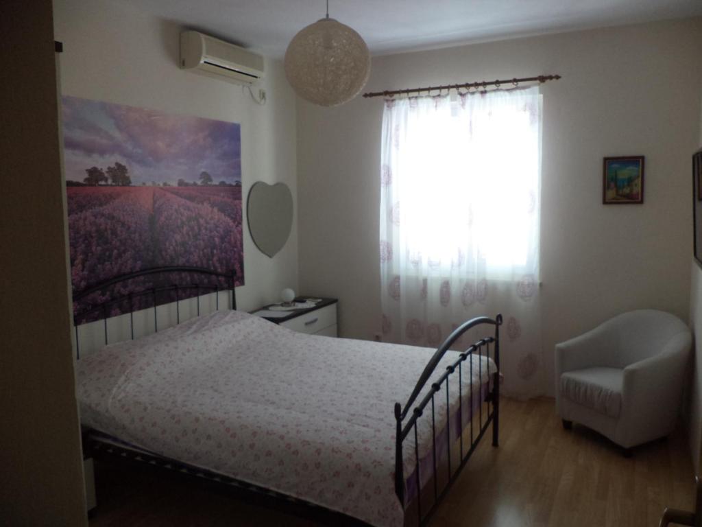 Posteľ alebo postele v izbe v ubytovaní Apartments & Rooms Abba