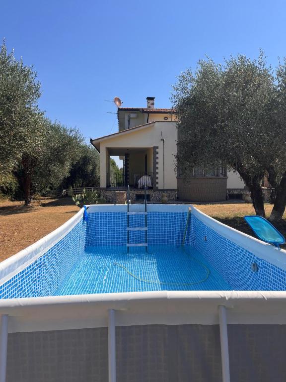 a swimming pool on the roof of a house at Villa Celestina, a 10 minuti dalle Terme in Vetralla