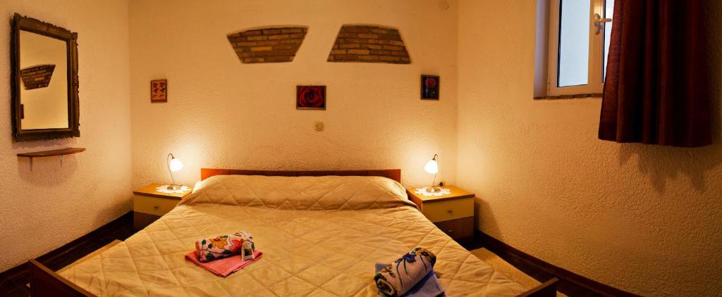 Postel nebo postele na pokoji v ubytování Apartments Percic