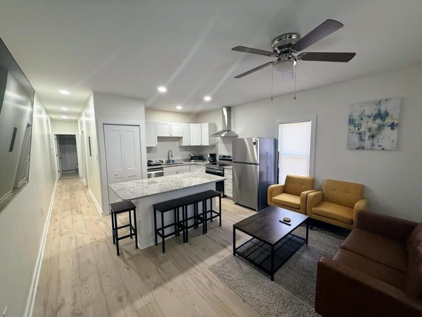 a kitchen and living room with a ceiling fan at Newly Renovated 2 Bedroom - B in Durham