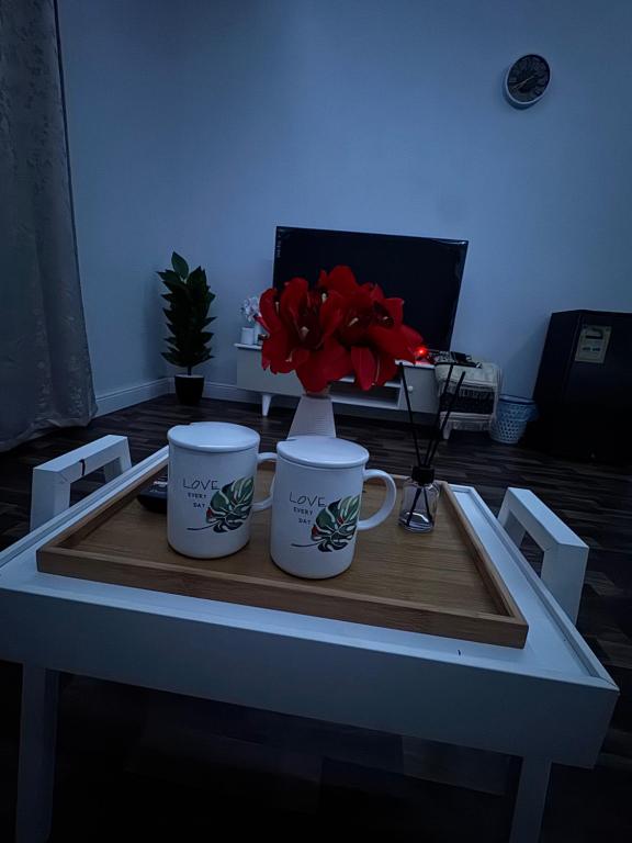 a table with two coffee mugs on top of it at استديو 1 in Jeddah