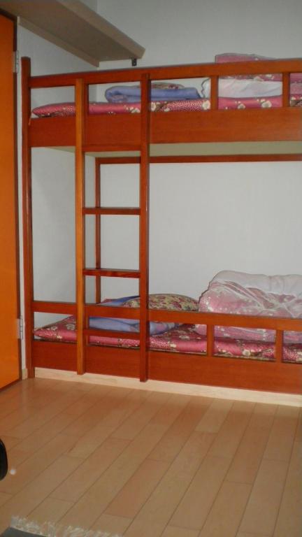 Postel nebo postele na pokoji v ubytování Asumi Onsen