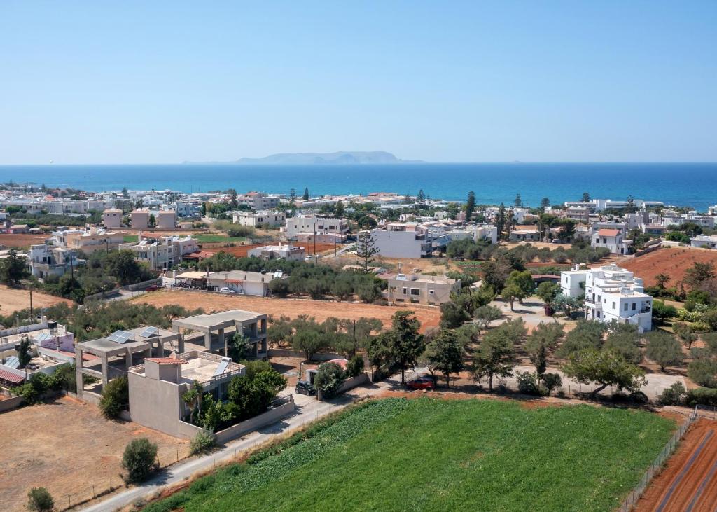 an aerial view of a city with the ocean at Villa Anna Nina in Gouves - 3BD Retreat - Sleeps 8 in Kato Gouves