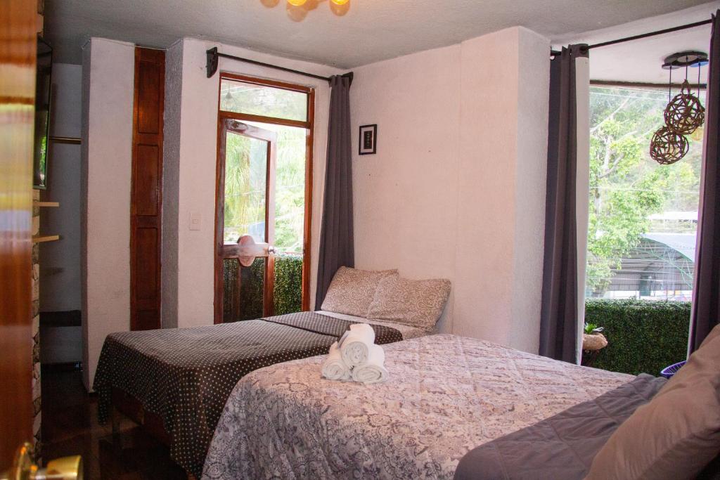 Postel nebo postele na pokoji v ubytování Hotel Diamantes Orizaba Boutique