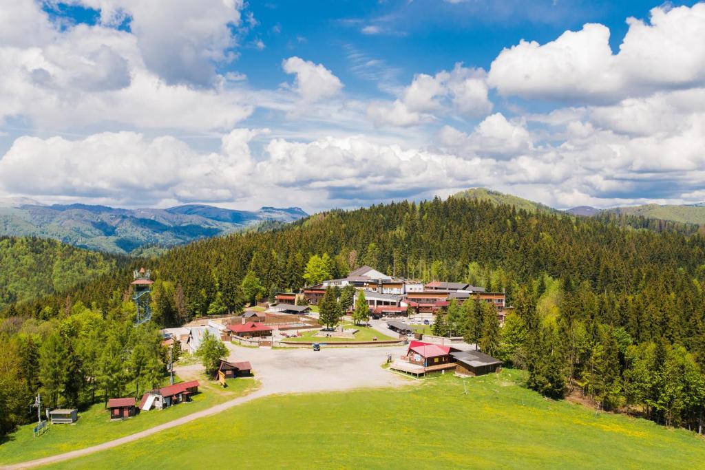 an aerial view of a resort in the mountains at Hotel Sachticka in Banská Bystrica