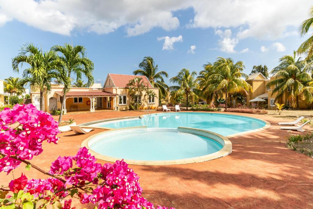 Bazén v ubytování L'Oasis des Vacances nebo v jeho okolí