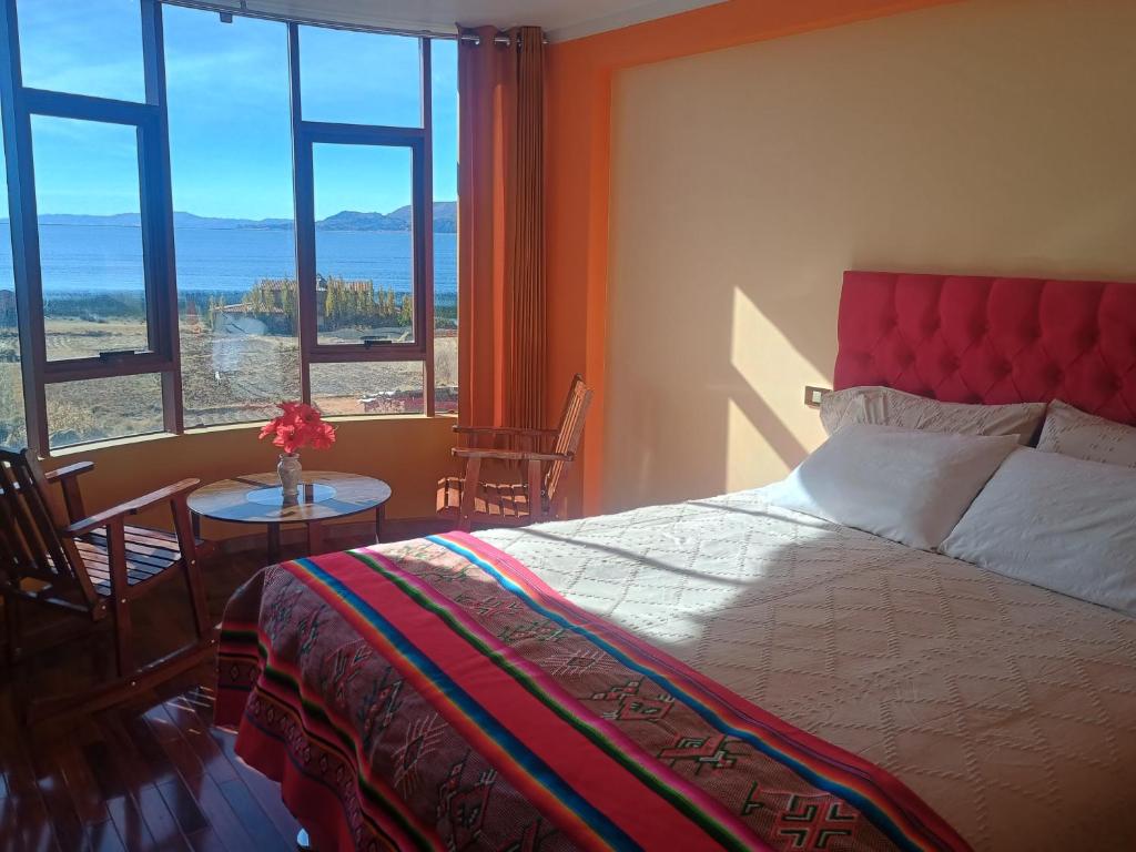 Ένα ή περισσότερα κρεβάτια σε δωμάτιο στο Luquina homestay